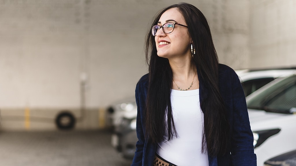 Beautiful young woman in the parking lot