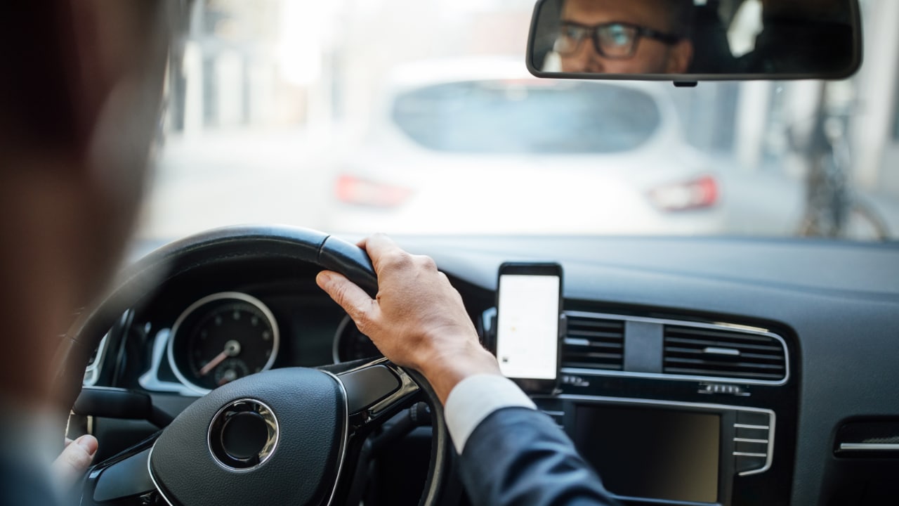 Man driving a car.